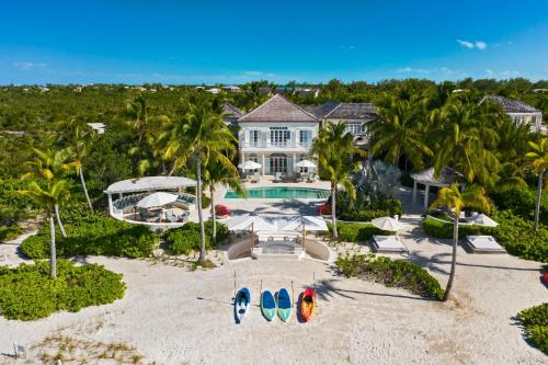 an aerial view of a house with a swimming pool at 7 bedroom plantation estate Villa in Leeward
