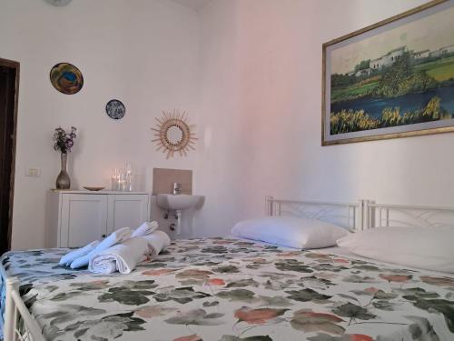 Ένα ή περισσότερα κρεβάτια σε δωμάτιο στο la gatta bianca