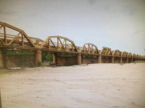 a bridge over a river with a dirt field at Sleep Inn & Suites Elk City in Elk City