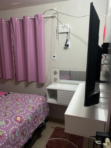 Ένα ή περισσότερα κρεβάτια σε δωμάτιο στο Casa da Amanda