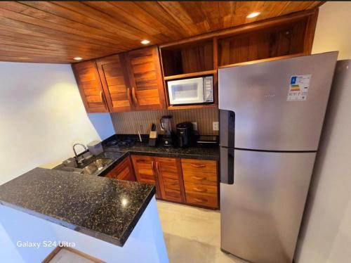 Kuchyň nebo kuchyňský kout v ubytování Casa Ó Paí - Chalés em Pontal de Maceió