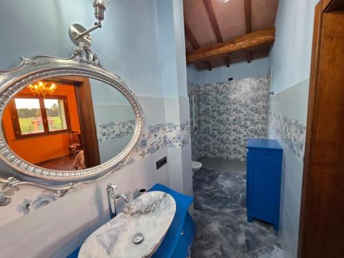a bathroom with a sink and a mirror at Villa Benedetti in Galleno