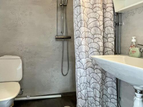 a bathroom with a sink and a shower curtain at Nature Retreat on Farm in Berga in Berga