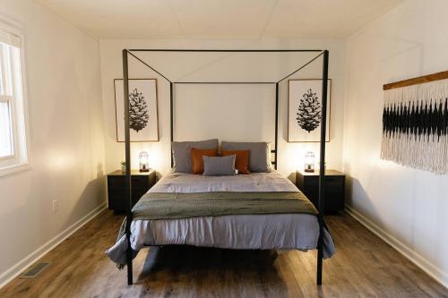 a bedroom with a large bed with a large headboard at "Morning View 3" Cozy Modern Stay - College/Hiking in Berea