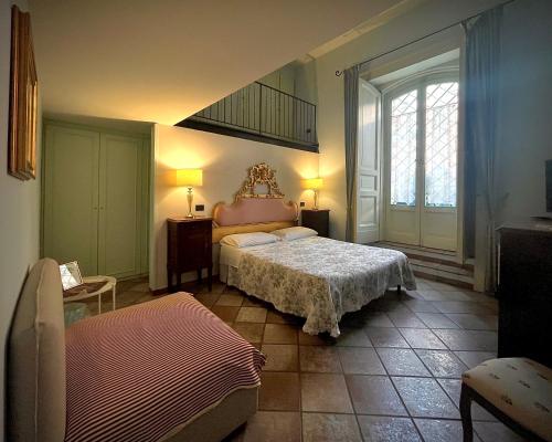 En eller flere senge i et værelse på B&B Palazzo Solimena