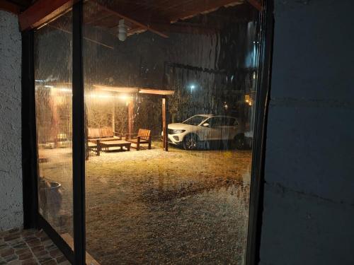 a car parked in a garage in the rain at El mirador natural in Villa Parque Siquiman