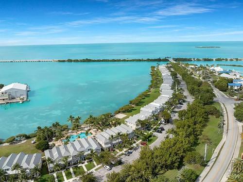 an aerial view of a resort next to the ocean at Villa del Sol - 2-3 Villa - OS Slip Ramp Pkg in Duck Key