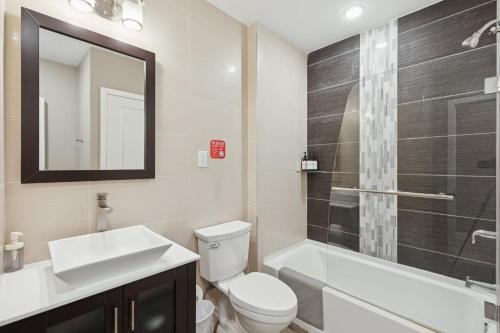 a bathroom with a toilet and a sink and a shower at Stay at Luna on Callowhill in Philadelphia