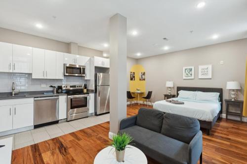 a kitchen and living room with a bed and a couch at Stay at Luna on Callowhill in Philadelphia