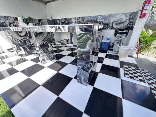 a black and white checkered floor in a room at Villa Seven in Guerra