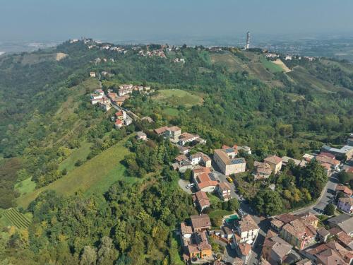 an aerial view of a town on a mountain at Oltre Natura in Canneto Pavese