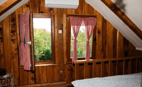 a bedroom with a bed and a window in a room at Ruralna kuća za odmor Brezanka, Zagrebačka ulica 21 Gornja Stubica in Gornja Stubica
