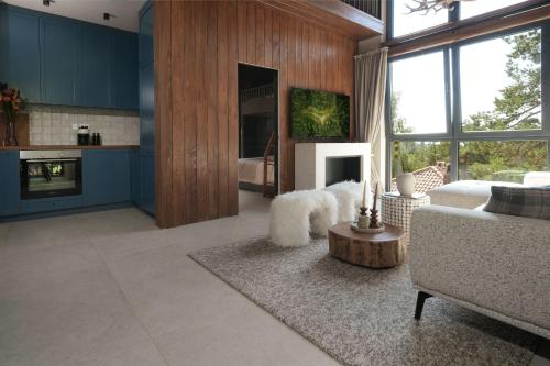 a living room with blue cabinets and a couch at Gigi Mountain Home in Divčibare