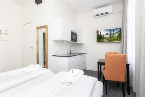 Ένα ή περισσότερα κρεβάτια σε δωμάτιο στο Hotell Drottninggatan 11