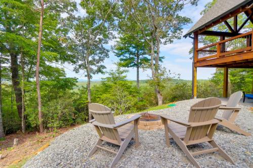 a table and chairs on a patio with a gazebo at Deck, Panoramic Views Serene Mineral Bluff Cabin! in Mineral Bluff