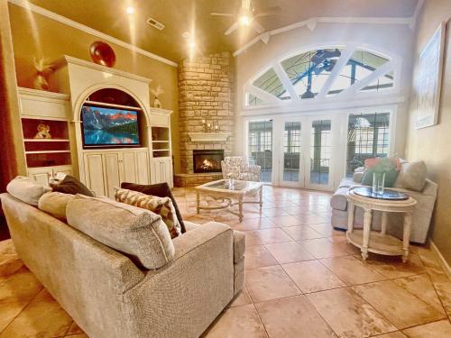 a living room with a couch and a fireplace at Casa Oasis Extra Large home centrally located in Johnson
