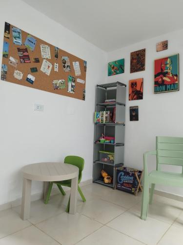 a table and a chair in a room at Casa Pino Campestre Panorámica in Jericó