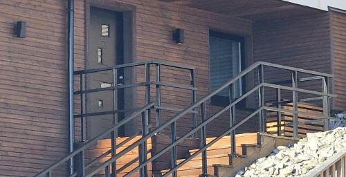 a metal staircase on the side of a building at New and modern apartment in Spydeberg