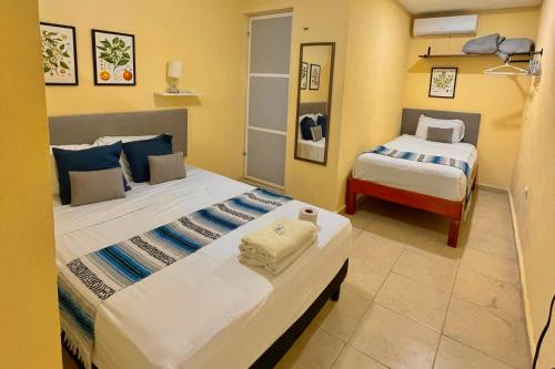 Кровать или кровати в номере Isla Mujeres Central Studio Ac & Kitchen