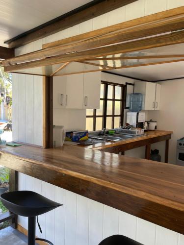 a large kitchen with a wooden counter top at Nhn Lodge in Avatoru