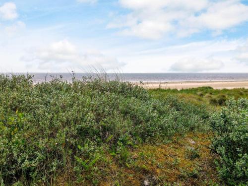 a view of the beach from a bluff at 6 person holiday home in Fanø in Fanø