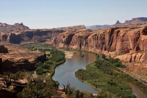 a river flows through a canyon in the desert at Moab Rim Cabin #16 in Moab