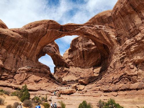 an arch in a rock formation in the desert at Moab Rim Cabin #16 in Moab