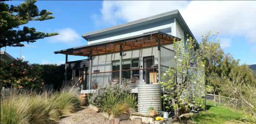 a house on a hill with a garden at D'entre Cabin in Woodbridge