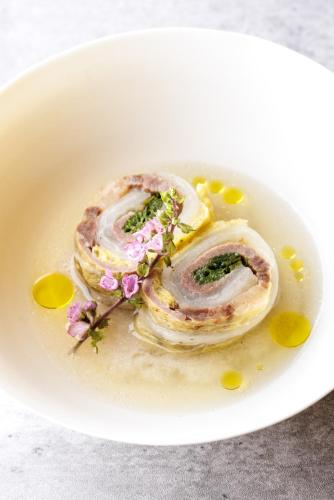 a plate of food with flowers on a plate at SHISHI-IWA HOUSE Karuizawa in Karuizawa