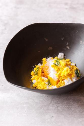 a bowl of rice with an egg on top at SHISHI-IWA HOUSE Karuizawa in Karuizawa