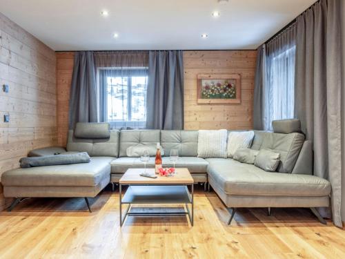 a living room with a couch and a table at Hausa Sommer in Grossarl