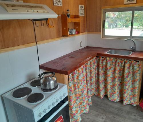 Kuchyň nebo kuchyňský kout v ubytování Cabaña para Desconectar