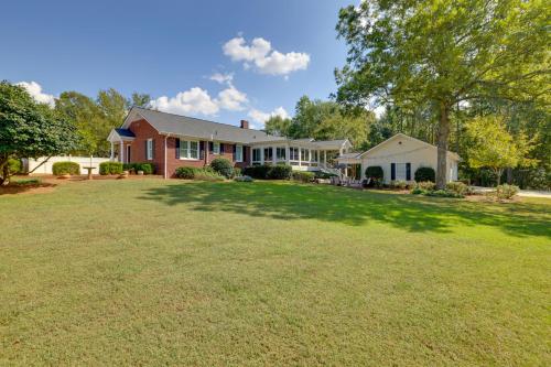 a house with a large lawn in front of it at 3 Mi to Dtwn Greer Mountain-View Home! in Greer