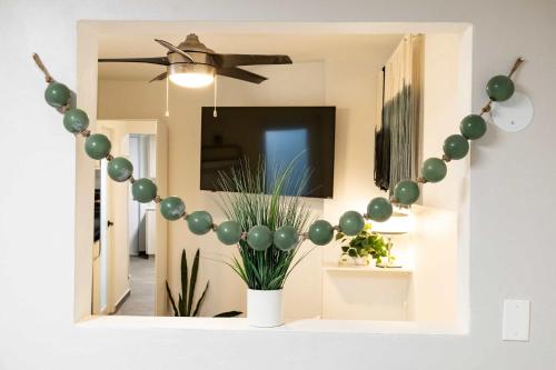 a room with a balloon arch on the wall at AQUA Terrazas Studio 3 - Beachfront, Pool, Local Fun & Dining in Dorado