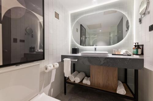 a bathroom with a sink and a mirror at Crowne Plaza Perth by IHG in Perth