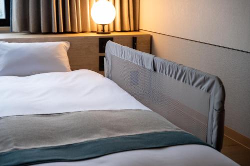 Ein Bett oder Betten in einem Zimmer der Unterkunft The Pulse Kirishima- Opening in 16th Aug 2025