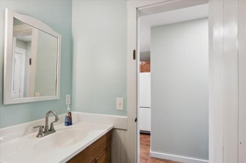a bathroom with a sink and a mirror at Elmore Meadows in Stowe