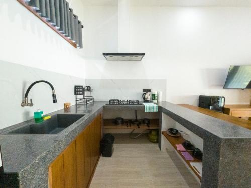 a kitchen with a sink and a counter at Terramar Villas in Kuta Lombok