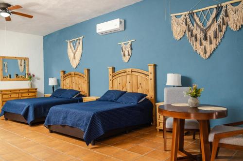 Ένα ή περισσότερα κρεβάτια σε δωμάτιο στο La Ilusión Hotel Campestre y Balneario