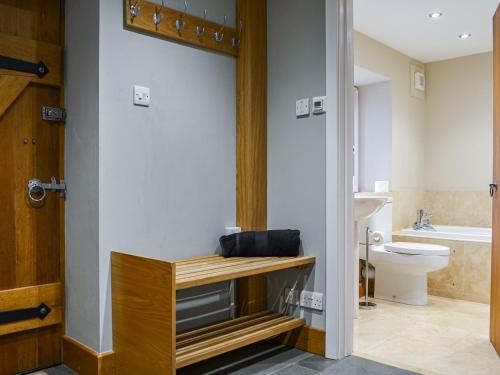 a bathroom with a toilet and a sink at Over Brandelhow in Borrowdale Valley