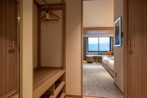 Ein Bett oder Betten in einem Zimmer der Unterkunft The Pulse Kirishima- Opening in 16th Aug 2025