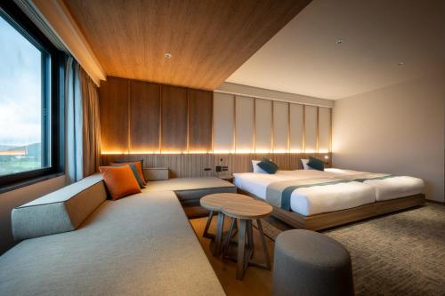Ein Bett oder Betten in einem Zimmer der Unterkunft The Pulse Kirishima- Opening in 16th Aug 2025