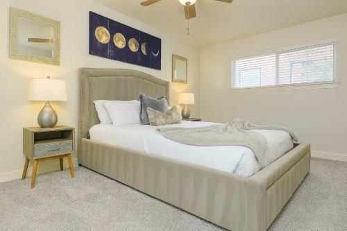a bedroom with a large bed and a window at Saltwater Pool 2BR Near Galleria Walkable, Stylish & Central Marquee Uptown in Houston
