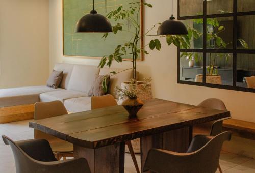 a living room with a table and a couch at Dhaus Country Club in Guadalajara