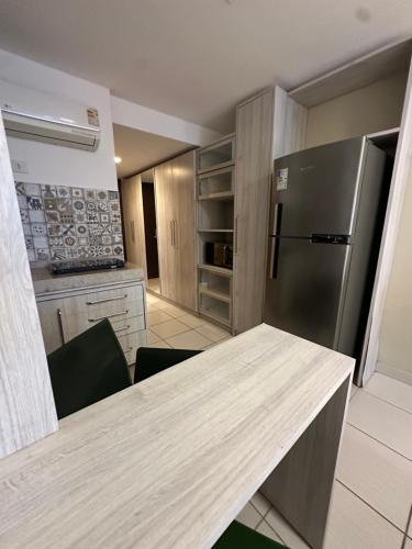 a kitchen with a counter top and a refrigerator at Seaside Refuge in Recife