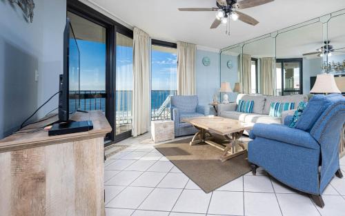 a living room with a couch and a tv at Phoenix VI 61004 in Orange Beach