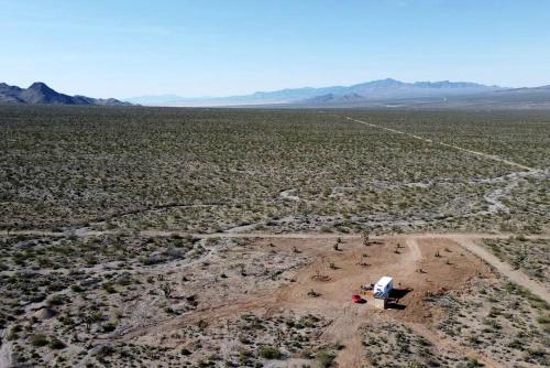 an aerial view of a desert with a tent at Stunning Tiny House with Picnic Space, Barbecue and Fire Pit in Meadview, Arizona in Ray Place