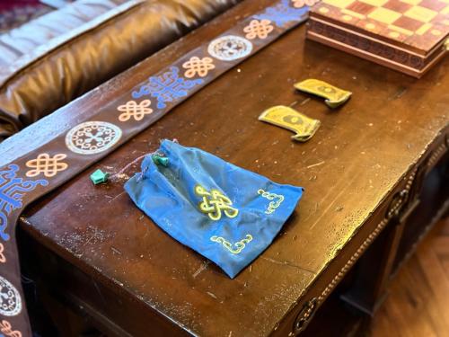 a wooden coffee table with a blue bag on it at Big Sky Lodge at Terelj in Ulaanbaatar
