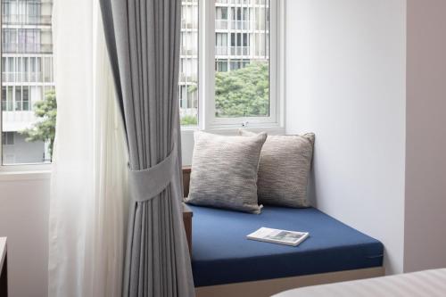 Ένα ή περισσότερα κρεβάτια σε δωμάτιο στο SOVA Hotel Bangkok