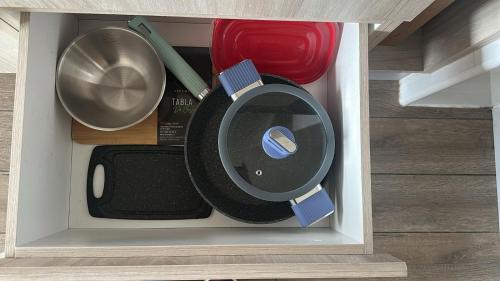 a drawer filled with various items in a room at Brisa del Sol, next to the airport & MDS Casino in Concepción